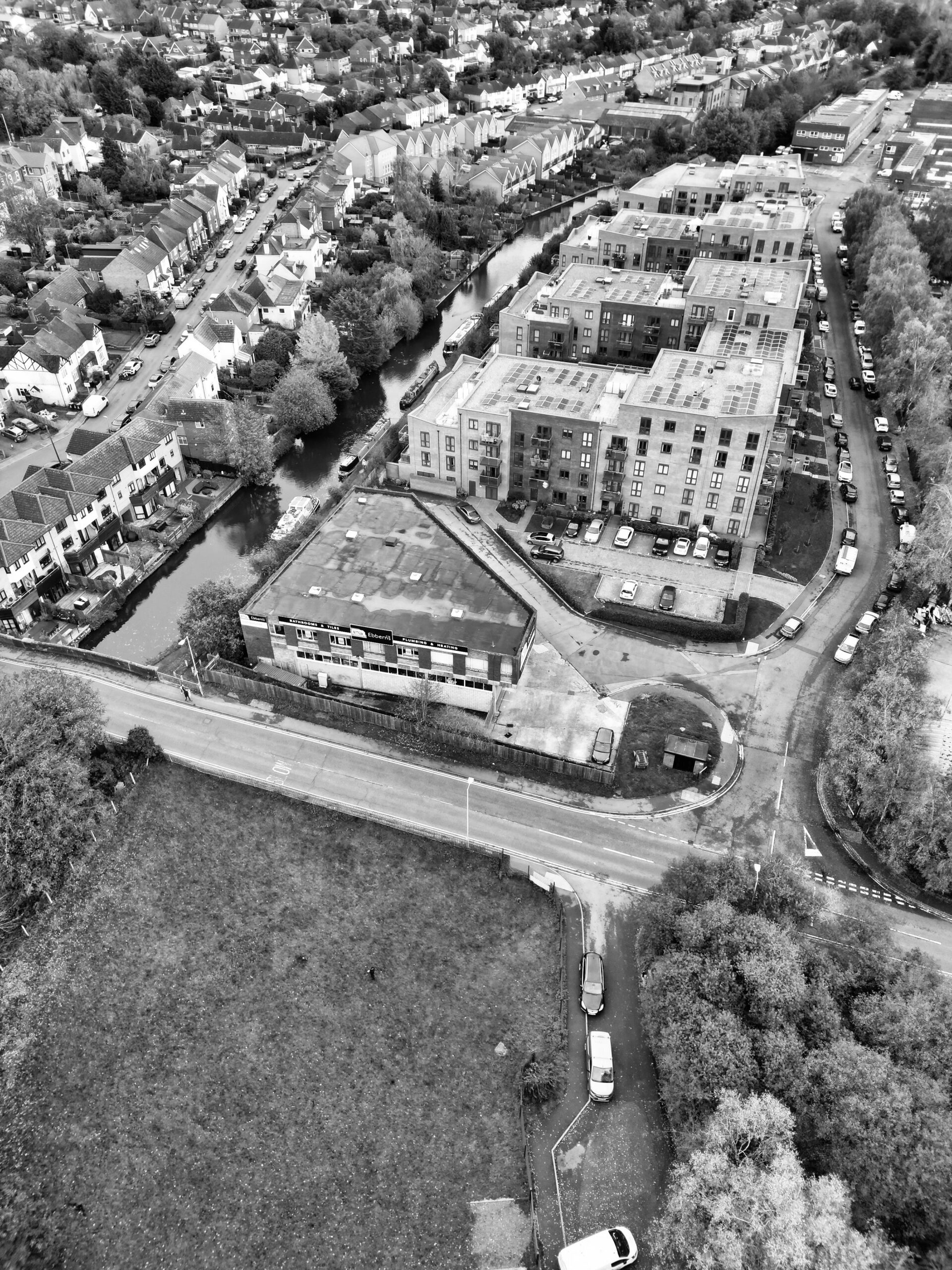 Black and white aerial shot of residential buildings and roads in Hemel Hempstead, England.